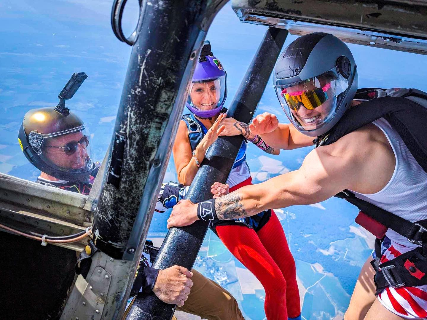 tandem skydiver smiles in freefall