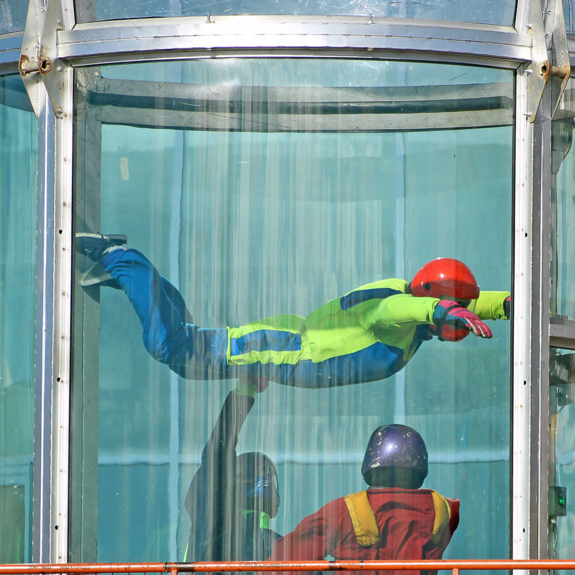 tandem skydiver smiles in freefall